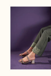 <img src="Trouser.jpg" alt="alt=a closeup image of a green trouser with heels">