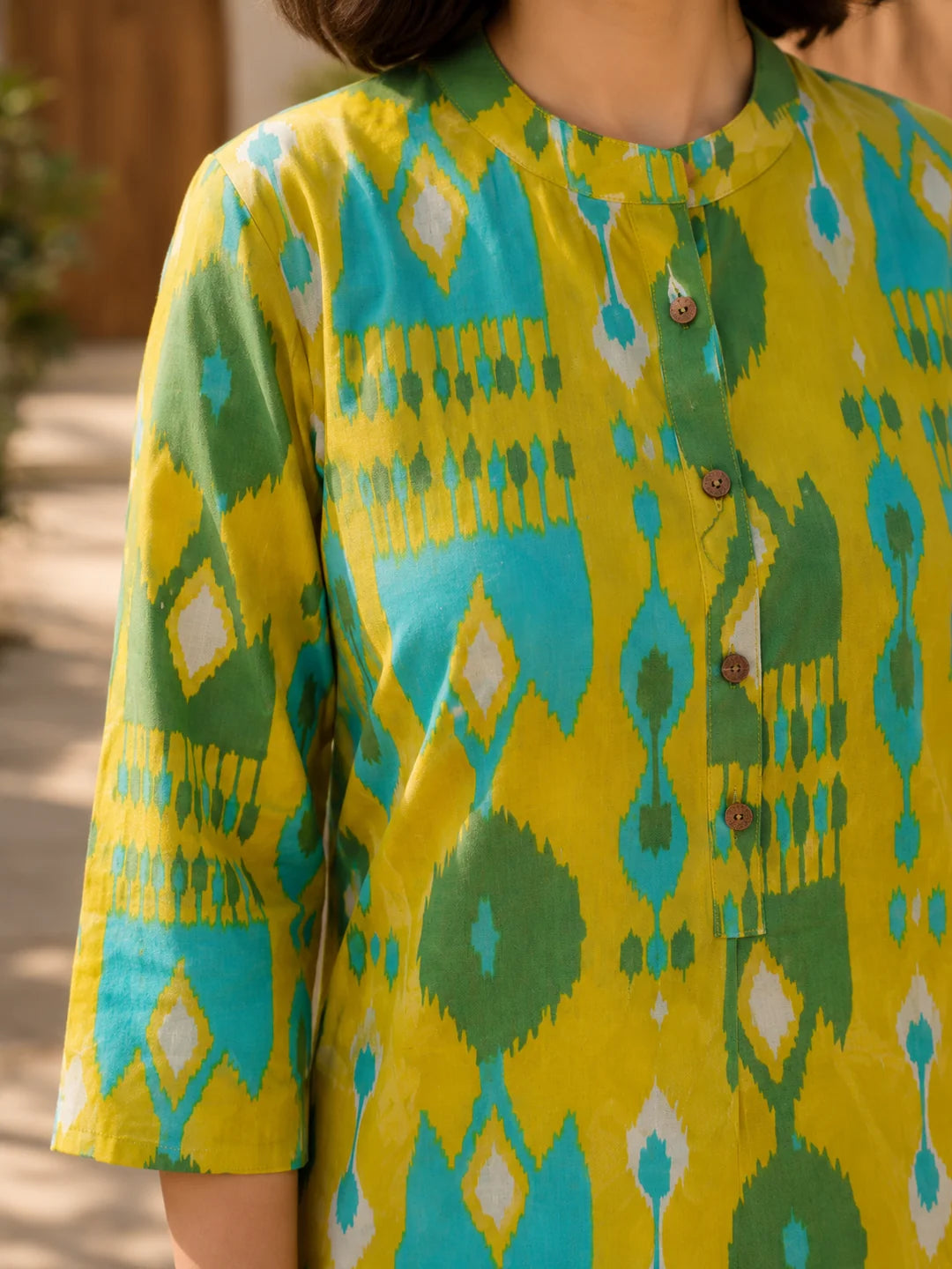 Yellow and Turquoise Ikkat Print Short Kurti in Cotton