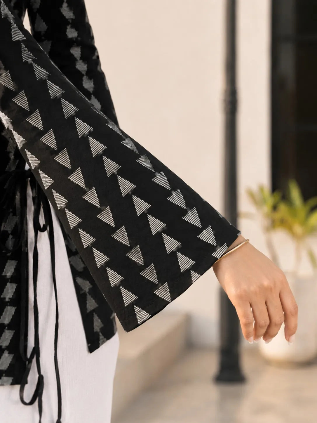 Black Geometric Triangle Print Short Kurti with Criss-Cross Tie Sides in Cotton