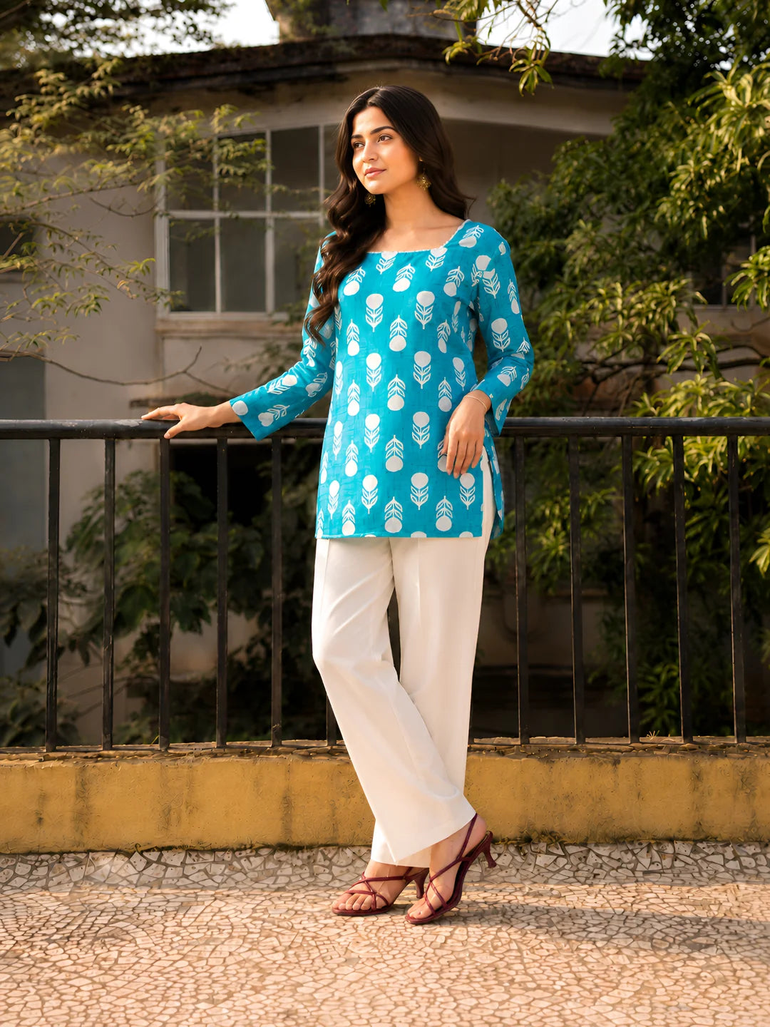 Blue women’s short kurti with elegant print and comfortable cotton fabric for daily fashion styling