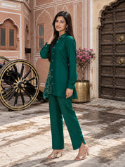 Conjunto coordinado de túnica y pantalón de muselina bordado en verde pavo real