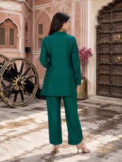 Conjunto coordinado de túnica y pantalón de muselina bordado en verde pavo real