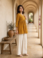 Mustard Yellow Gathered Bust Floral Buta Flared A-Line Short Kurti in Cotton