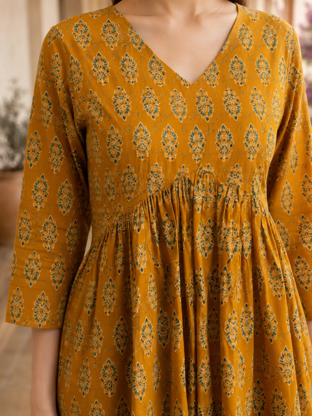 Mustard Yellow Gathered Bust Floral Buta Flared A-Line Short Kurti in Cotton